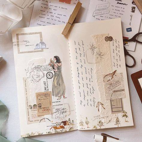 Open journal layered with vintage stickers, stamps and handwritten notes