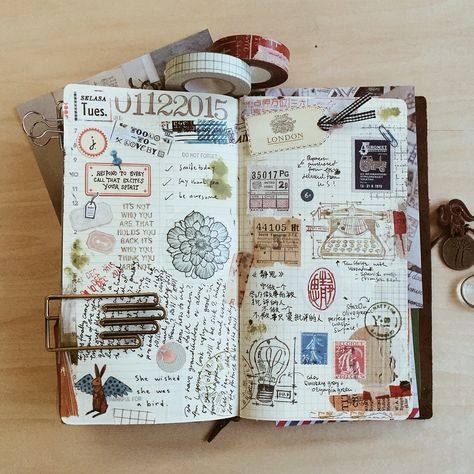 Travel journal spread with ticket stubs, stamps and washi tape rolls
